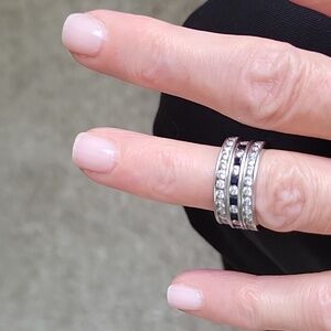 Set of 3 14k wg cz eternity bands. 2 white, one is simulated sapphire & white